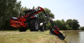 Umfahren von Hindernissen mit dem KUHN-Böschungsmäher AGRI-LONGER GII mit Anfahrsicherung am Drehgelenk