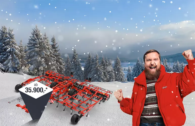 Eine Darstellung des Prolander 6000, welcher in der KUHL!-Winteraktion angeboten werden und Kuhnibert, ein bärtiger Mann in KUHN-Jacke, der sich darüber freut.